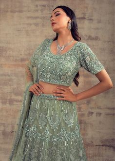 Keep your style spirit high and classy with this Sage green coloured lehenga BAHAAR! No matter whether designers are the initiators of trends, we women have the deciding power to choose which styles are here to stay. As we have too much responsibility on our shoulders, we can’t make bad decisions for women around the world. So don’t overthink, just grab this sage green coloured lehenga that will complement your festive and casual look. This lehenga is beautified with tonal and silver hand embroi Green Color Wedding, Curated Outfit, Sage Green Color, Add Sleeves, Women Around The World, Color Wedding, Bad Decisions, Wedding Lehenga, Bridal Wedding Dresses