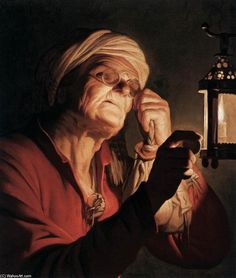 an old woman holding a lantern and looking at the light in front of her face