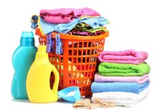 a pile of laundry and cleaning supplies sitting next to each other