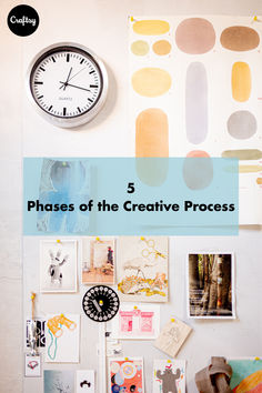 a white wall with pictures and a clock on the wall above it that says phases of the creative process