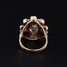 This vintage ring (circa 1960-1970) features assorted gemstones in 14k gold. The gemstones include garnet, zircon, emerald, sapphire, aquamarine, and chrysoberyl. The face of the ring measures 0.9 inches by 0.8 inches wide and is in very good condition with light surface wear. The ring is currently a size 6, but it can be resized free of charge. Materials: 14k gold, chrysoberyl, aquamarine, sapphire, emerald, zircon, garnet. Vintage Multi-stone Ruby Ring In 14k Gold, Vintage Multi-stone Diamond Ring For Collectors, Vintage Multi-stone Diamond Ring Collectible, Vintage Multi-stone Sapphire Ring, Antique Green Multi-stone Ring, Antique Multi-stone Round Emerald Ring, Vintage Multi-stone Green Emerald Ring, Antique Round Multi-stone Emerald Ring, Vintage 14k Gold Multi-stone Ruby Ring