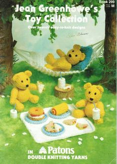 a crocheted teddy bear picnic with two other bears in the grass and one is eating