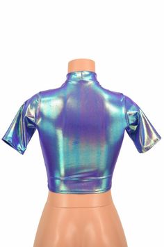 "This item is made to order, please read all the way through the listing before purchasing! This shiny, liquidy holographic top has a smooth reflective finish that bends the light in beautiful shifting rainbows. It features a high short collar neckline and cute little tee length sleeves. Four way stretch spandex for a great fit! TOP LENGTH: Underarm to hemline measures 8\" Womens Sizing (See below for instructions on where measurements should be taken) XXS: Bust 29\"-30\" / Waist 22\"-23\" / Hip Shiny Stretch Trendy Tops, Trendy Shiny Stretch Tops, Trendy Fitted Shiny Tops, Metallic Shiny Disco Top, Shiny Stretch Disco Tops, Stretchy Shiny Disco Tops, Fitted Metallic Shiny Tops, Metallic Shiny Fitted Tops, Metallic Shiny Stretch Tops