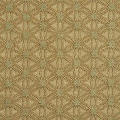 an upholstered area rug in beige and green