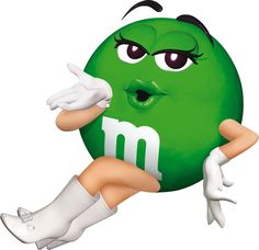 a woman in white gloves holding up a green ball with the letter m on it