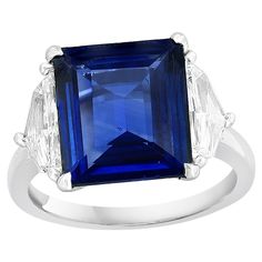 Showcases a Certified Emerald cut, Vibrant color Sri Lankan Ceylon Blue Sapphire weighing 2.84 carats, flanked by two brilliant shield cut diamonds weighing 0.59 carats in total. Elegantly set in a polished platinum composition. Engagement Ring Modern, Sapphire And Diamond Engagement Ring, Diamond Sapphire Engagement Ring, Ceylon Blue Sapphire, Modern Engagement Rings, Engagement Rings Platinum, Emerald Cut Diamond, Engagement Ring Cuts, Platinum Ring