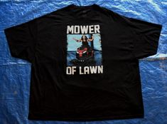 a black t - shirt with the words mower of lawn on it and a photo of