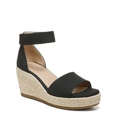 When it comes to wedges we’re all about them. Easily adjustable this wedge sandal with a peep toe and espadrille details provides all-day comfort. Inspired by the way you live.Peep toe espadrille wedge with textured sole. Manmade upper with an open toe. All-Thru Comfort: soft foam lining arch support with memory foam antimicrobial sock lining lightweight and flexible outsole. 2 3/4"" wedge heel. Consciously packaged: 100% of our shoe boxes are made of 80% recycled paper + soy-based ink. Designed Peep Toe Wedge Sandals, Womens Espadrilles Wedges, Shoe Boxes, Trending Sandals, Ankle Strap Wedges, Strap Wedge, Womens Sandals Wedges, Black Wedge Sandals, Naturalizer Shoes