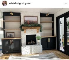 a living room filled with furniture and a fire place in front of a fireplace covered in greenery