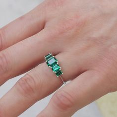 Spectacular. Stunning. Unforgettable. In our new Alexandrina ring we created a goldsmith masterpiece unlike anything else. Five large and deep-green emeralds are elevated above the ring with an elegant bridge decorated with our signature sign, forming an architectural perfection on your finger. It's not just a bling, the skilled craftsmanship and unique design turn the Alexandrina ring into a true heirloom that will never go out of style and will be passed through generations. **Due to the nature of the natural Emerald the color may vary** All features can be customized! please contact us if you wish to make changes, we love making custom designs. All of our jewelry is carefully handmade in our atelier *HC diamond are all conflict free diamonds To order by phone click here>> +972(0)7229910 14k White Gold Green Emerald Ring, Fine Jewelry Emerald Ring In 14k White Gold, Gift Emerald Multi-stone Ring In White Gold, White Gold Multi-stone Emerald Ring Fine Jewelry, 14k White Gold Emerald Ring, May Birthstone, Pendant Rings, Girls Earrings, Natural Emerald, Bracelet Collection