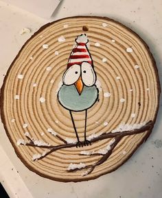 a piece of wood with a bird painted on it