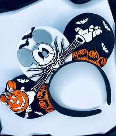 the mickey mouse ears are decorated with pumpkins