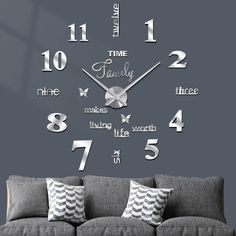 a living room wall clock with the words time family on it's face and numbers