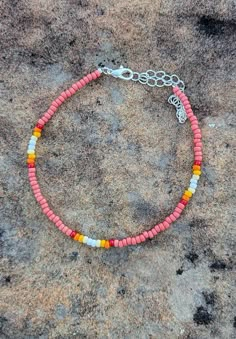 A super fun accessory to dawn during the summer! Seed Bead Summer Bracelets, Summery Bracelet Ideas, Tiny Seed Bead Bracelets, Bracelet Patterns Seed Beads, Summer Anklets Diy, Small Bead Bracelets Ideas Summer, Seed Bead Anklet Ideas, Beaded Summer Jewelry, Cute Summer Bracelets