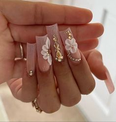 Blush Pink And Gold Quince Nails, Quince Makeup Looks With Rhinestones, Different Types Of 3d Flowers Nails, White French Tip With Gold Diamonds, Acrylic Nails Ideas Rhinestones, Pink Nails Acrylic Quince, Long Square Acrylic Nails Flowers, Medium Square Birthday Nails, Short Quinceanera Nails