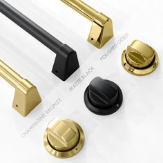 an assortment of brass and black handles, knobs, and pulls on a white surface