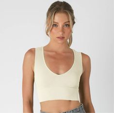 Size: One Size. A ribbed knit crop top featuring a plunging v-neckline Fabric: 92% Nylon / 8% Spandex. Made in the USA All-time best seller A stylish and versatile top featuring a seamless design, a plunging V-neckline, and a cropped length. This top offers a flattering silhouette and can be dressed up or down for various occasions, making it a must-have wardrobe staple Seamless V-neck Top For Summer, Trendy Solid V-neck Crop Top, Trendy Seamless V-neck Crop Top, Chic Seamless Low-cut Crop Top, Chic V-neck Seamless Crop Top, Seamless Fitted V-neck Crop Top, Stretch Solid V-neck Crop Top, Solid Stretch V-neck Crop Top, Fitted V-neck Seamless Crop Top