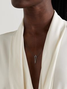 Eva Fehren's 'Dagger' necklace is strung with a geometric pendant inspired by the sharp lines of NYC's architecture. It's handmade from 18-karat blackened white gold and set with pavé diamonds. Sapphire Necklace Gold, White Sapphire Necklace, White Gold Diamond Necklace, Dagger Necklace, White Diamond Necklace, Flat Dress Shoes, Gold Diamond Necklace, Geometric Pendant, Sapphire Necklace