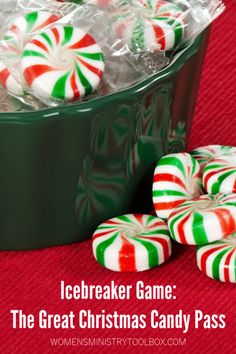 some candy canes are in a green container on a red tablecloth with the words icebreaker game the great christmas candy pass