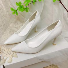 -Material: HIGH QUALITY PU silk material, sparkling, high-class, soft, with PURE WHITE color to help you STAND OUT IN THE CROWD -Suitable width: Yes -Origin: Vietnam -Heel height: Medium -Occasion: Formal -Shoe toe style: Pointed toe -Lock style: plain -Heel height: medium STANDARD FORM, COMFORTABLE FOR FEET: The shoes are meticulously designed with a standard form, helping to protect and cherish her feet, keeping good shape. HIGH-QUALITY TPR SHOE SOLE, HIGHLY ELASTIC, NOISE REDUCTION: The shoe Elegant Fabric High Heels, Elegant Fabric Heels With Pointed Toe, Elegant Pointed Toe Fabric Heels, Elegant Fabric Heels For Party, Elegant Fabric Heels For Formal Occasions, White Glitter Party Heels, White Fabric Heels For Party, White Fabric Party Heels, White Fabric High Heels