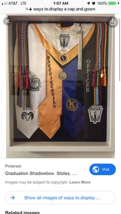 an image of graduation ties displayed in a shadow box with the caption's name below it