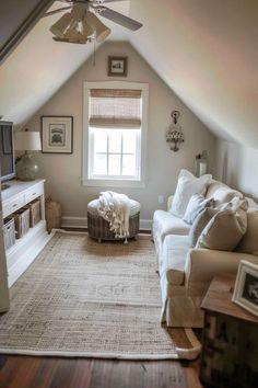 a living room filled with furniture and a ceiling fan