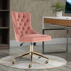 a pink office chair sitting on top of a white rug in front of a desk