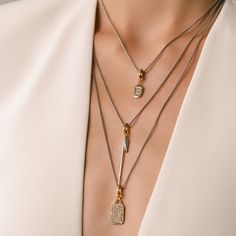 Introducing a masterful juxtaposition of art and identity: a three-tiered necklace ensemble that seamlessly melds the raw edge of a zirconia-accented needle with the intimate touch of personal initials. Complementing this is the pave tag, which dances with light at every turn. Set of 3 separate chains Stainless steel - 1mm Wide / 16"-20"-24" Length Just click needle charm Pave zirconia tag charm Letter just click charm Tarnish resistant Tiered Necklace, Keep It Real, Polish Jewelry, Necklace Sizes, Raw Edge, Rhodium Plated, Necklace Set, Labour Day, Solid Gold