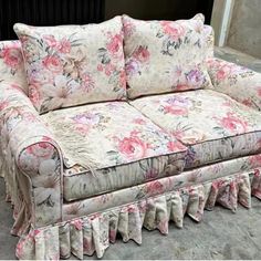 a floral couch with ruffles on it