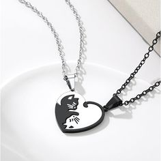 Cat Matching Necklace Set-- 27mm(1.06"), Height: 38mm(1.46"); Weight: 18g With 20+2 Inch Extend Chain Which Symbolize Pure Friendship, Love And Family Affection. Easy Clasp & Strong Links-- High Quality Stainless Steel Materials, Carved Texture Clear. Stainless Steel & Gold Plated Jewelry Does Not Tarnish And Oxidize, Which Can Last Longer Than Other Jewelries. It Is Able To Endure A Lot Of Wear And Tear. Eye-Catching Couples Stitching Pendants-- The Cats Represent Yin And Yang. With Attractive Black Stainless Steel Heart Pendant Necklace, Black Stainless Steel Heart Necklace, Black Stainless Steel Necklace For Valentine's Day, Silver Heart-shaped Cat Design Jewelry, His And Hers Necklaces, Heart Cats, Love And Family, Friendship Jewelry, Friendship Love