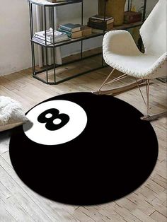 a black and white rug with a eight - ball on it in a living room