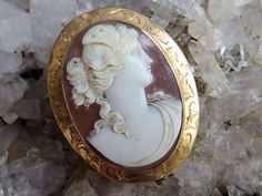 "Here is another wonderful piece from a friend's grandmother's collection of jewelry, and this cameo likely came from that lady's grandmother.  It is a beauty, with a detailed high relief carved image of Psyche, with a draped gown and butterfly wings in her hair. The brooch measures slightly under 2\" high and is 1 1/2\" wide and is signed '10k' on the lever style clasp.  The piece weighs 9.7 grams and is in very good antique condition with no flaws that I have seen.  There is a bit of dust in t White Oval Cameo Brooches, Oval Cameo Brooches As Gift, Carved Oval Brooch As Gift, Carved Oval Brooch For Gift, Heirloom Cameo Brooch Gift, Heirloom Cameo Brooches For Gifts, Heirloom Cameo Brooches As Gift, Carved Oval Brooches As Gift, Antique Oval Cameo Brooch