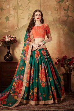 You will definitely earn lots of compliments wearing this organza based designer lehenga choli in orange colored blouse paired with contrasting pine green colored lehenga and dupatta. Its blouse is silk based beautified with embroidery paired with organza fabricated lehenga and dupatta beautified with prints. Product Features:   Lehenga Color: Pine Green Blouse Color: Orange Dupatta Color: Pine Green Lehenga Fabric: Organza Blouse Fabric: Art Silk Dupatta Fabric: Organza Type of Work: Printed an Organza Floral Lehenga, Embroidery Sleeves, Green Lehenga Choli, Orange Lehenga, Organza Bridal, Floral Lehenga, Organza Lehenga, Green Lehenga, Outfits Dress