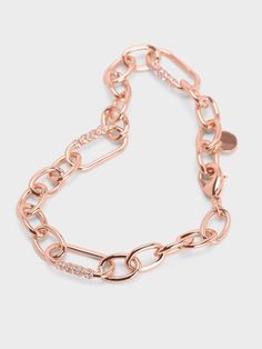 For a wearable yet glamorous addition to your everyday stack, the Reagan bracelet is the perfect choice. The classic chain-link design is adorned with Swarovski crystal embellishments that lend sparkle to the beautiful rose gold finish. Affixed with a lobster clasp, it is easy to put on and take off while offering a secure fit. Let this jewellery piece add a touch of elegance to all your ensembles. Link Design, Crystal Chain, Charles Keith, Crystal Embellishment, Beautiful Rose, Chain Link Bracelet, Beautiful Roses, Link Bracelets, Sales Gifts