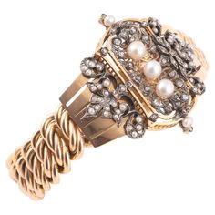 In the center, a diamond-shaped curved motif decorated with fleur-de-lis punctuated with rose-cut diamonds and button pearls. Wristband with American gourmette links. Set in 18K yellow and rose gold. French work. Maker's mark of GUILLEMIN Frères, Boivin successor. Weight: 59.43 g. Dimensions of central motif: 4.7 x 4 cm. Rose Bracelet, Napoleon Iii, Yellow Gold Bracelet, Rose Cut Diamond, Rose Cut, Link Bracelets, Diamond Shapes, Or Rose, Diamond Cuts