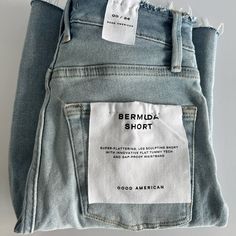 Good American Raw Hem Denim Bermuda Shorts In Blue689 Size 00/24 - Brand New With Tags - Color: Blue689 - Size: 00/24 - Super Flattering, Leg Sculpting Shorts - Innovative Flat Tummy Technology - Gap Proof Waistband - Material: 94% Cotton, 4% Elasterell-P, 2% Elastane - Retails For $119 Blue Jeans With Frayed Hem Short Leg, Straight Leg Jeans With Built-in Shorts, Light Wash Short Jeans For Everyday, Denim Jeans With Built-in Shorts And Straight Leg, Fitted Short Jeans For Everyday Wear, Everyday Fitted Short Jeans, Fitted Straight Leg Jean Shorts For Everyday, Dark Wash Straight Leg Jean Shorts, Denim Blue Straight Leg Shorts