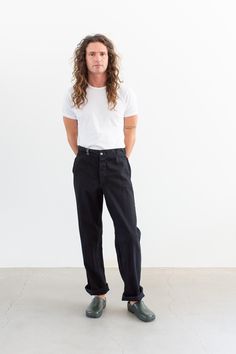 These workwear cotton twill pants feature the following: button fly, high rise, belt loops, front pockets, back pockets. Straight leg. Gusseted inner leg seam. These were originally white workwear chinos, now dyed black. Unisex Fit so the hips are more narrow than modern women's pants. One belt loop is grey. Raw hem - please request a hem if you want one. Material: 100% Cotton Twill  | Made in the USA in the 60s. Garment Dyed in Los Angeles in 2022. Condition: Great.   Measurements: 34" Waist / 39" Hips / 11.5" Rise / 12.75" Thigh / 9" Leg Opening / 34" Inseam - raw seam Elijah is 6'0" with a 30" waist. This pair could fit a larger frame. SHOP http://www.rawsonstudio.etsy.com FOLLOW US + instagram | @_rawson  + pinterest | rawson *No Returns. Items are eligible for store credit only. We as Utility Pants, Twill Pants, Modern Woman, Black Cotton, Cotton Twill, Work Wear, Straight Leg, Halloween Shopping, Favorite Outfit