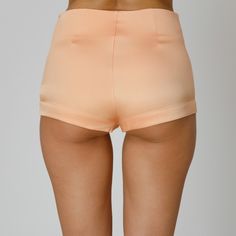 Introducing our Orla Silk Shorts, blending luxurious comfort with versatility. Expertly crafted from coral double silk satin, they feature a mid-waist and a sleek design, completed by a concealed side zip closure. Pair them with a breezy cover-up for a chic seaside look or dress them up under sheer dresses, for an elevated yet relaxed ensemble.  Match: Wear them under our Orla Silk Shirt Dress. Each Il Volo item is handmade by skilful artisans in our Bucharest atelier and it is created in limited series. 100% Italian Double Silk Satin.  Gentle dry clean. Do not wash. Do not use chlorine based bleach. Do not tumble dry. Cool iron, max 110 C.  Made in EU. Pink Stretch Satin Bottoms, Stretch Satin Bottoms For Summer, Spring Satin Bottoms In Short Length, Fitted Satin Summer Pants, Fitted Satin Bottoms For Summer, Fitted Satin Pants For Summer, Fitted Satin Short Length Bottoms, Summer Satin Short Bottoms, Summer High Waist Satin Bottoms