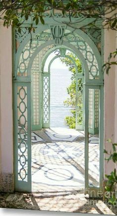 an open door leading to the ocean