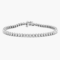 This tennis bracelet with moissanite diamonds has a special design that makes it stand out from others. It is a bezel set tennis bracelet with moissanite diamonds that provide exceptional sparkle. The bracelet is made of 925 sterling silver and is available in different wrist sizes for women. It is a high quality and durable piece of jewelry that will stay with you for a long time. This tennis bracelet with diamonds is a perfect gift for your wife. A tennis bracelet with moissanite diamonds is a Diamond White Tennis Bracelet With Bezel Setting, Classic Tennis Bracelet With Bezel Setting, Classic Round Tennis Bracelet With Bezel Setting, White Gold Tennis Bracelet With Bezel Setting, Elegant Pie, Bracelet With Diamonds, Bracelet Tennis, Gold And Silver Bracelets, Wedding Jewelry Bracelets