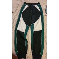 Size Small Womans Pants. Brand New. Tight At Waist And Hips, Loose On Legs, And Then Jogger Style At The Bottom. Has Stretch To It. Cute With A Crop Top And High Heels. Black, Green, And White. Zips Up The Middle. Trendy Green Stretch Sweatpants, Trendy Green Joggers, Green Stretch Joggers For Streetwear, Trendy Green Joggers For Streetwear, Green Casual Fitted Joggers, Green Trendy Streetwear Joggers, Trendy Green Streetwear Joggers, High Waist Sporty Joggers For Streetwear, Trendy High Waist Green Sweatpants