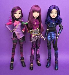 three dolls standing next to each other on a purple background