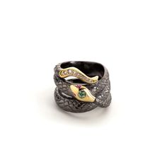 18K yellow gold & black rhodium silver snake ring with 0.15 cttw green sapphires, 0.06 cttw purple sapphires, and 0.09 cttw G-H/SI diamonds.  All sales are final. Please see our full cancellations & returns policy here Serpent Snake, Serpent Ring, Snake Ring Silver, Silver Bodies, Gold Face, Snake Jewelry, Love Note, New Year's Eve Party, Purple Sapphire