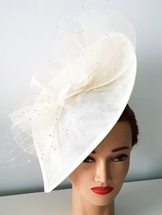 Hottest wedding hat on this season! Luxury You collection Limited Edition Lovely bridal hat perfectly hand made and decorated best quality crinoline and exotic feathers nad birdcage veil Ideal for wedding , coctail, derby and party. Sophisticated and glamorous The item is made to order in ivory, white Black, Royal Blue, navy blue color. Different color- please, asked me. The hat is made on headband for easy and secure positioning Cream Headpieces For Spring Ceremonies, Cream Mini Hat For Summer Ceremony, Cream Mini Hats For Summer Ceremonies, Cream Mini Hat For Summer Ceremonies, Summer Ceremony Cream Mini Hats, Adjustable Fascinator For Wedding, Adjustable Wedding Fascinator, Elegant Cream Fascinator For Events, Cream Structured Crown Headpiece