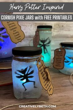 three jars filled with different colored lights and some writing on the jar are labeled harry potter inspired