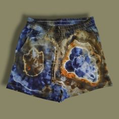 a tie dyed shorts with an orange and blue design