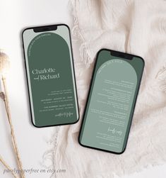 two cell phones sitting next to each other on top of a white table with flowers