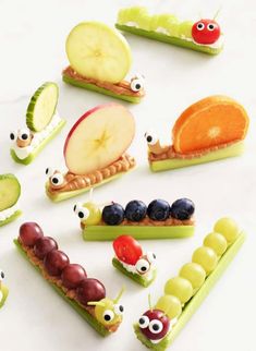 an assortment of fruits and vegetables made to look like caterpillars