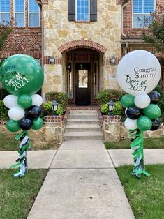 some balloons are in front of a house