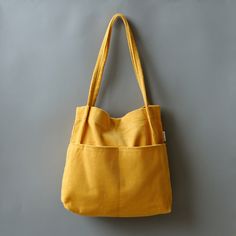 a yellow purse hanging on the wall